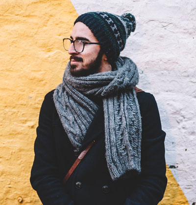 Man wears a jacket and tie